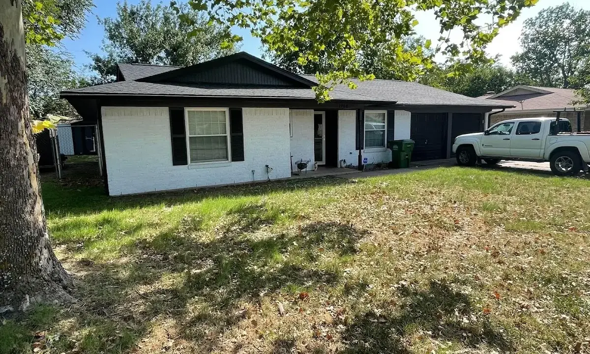 Professional roofing crew working on a residential roof in Lyndhurst